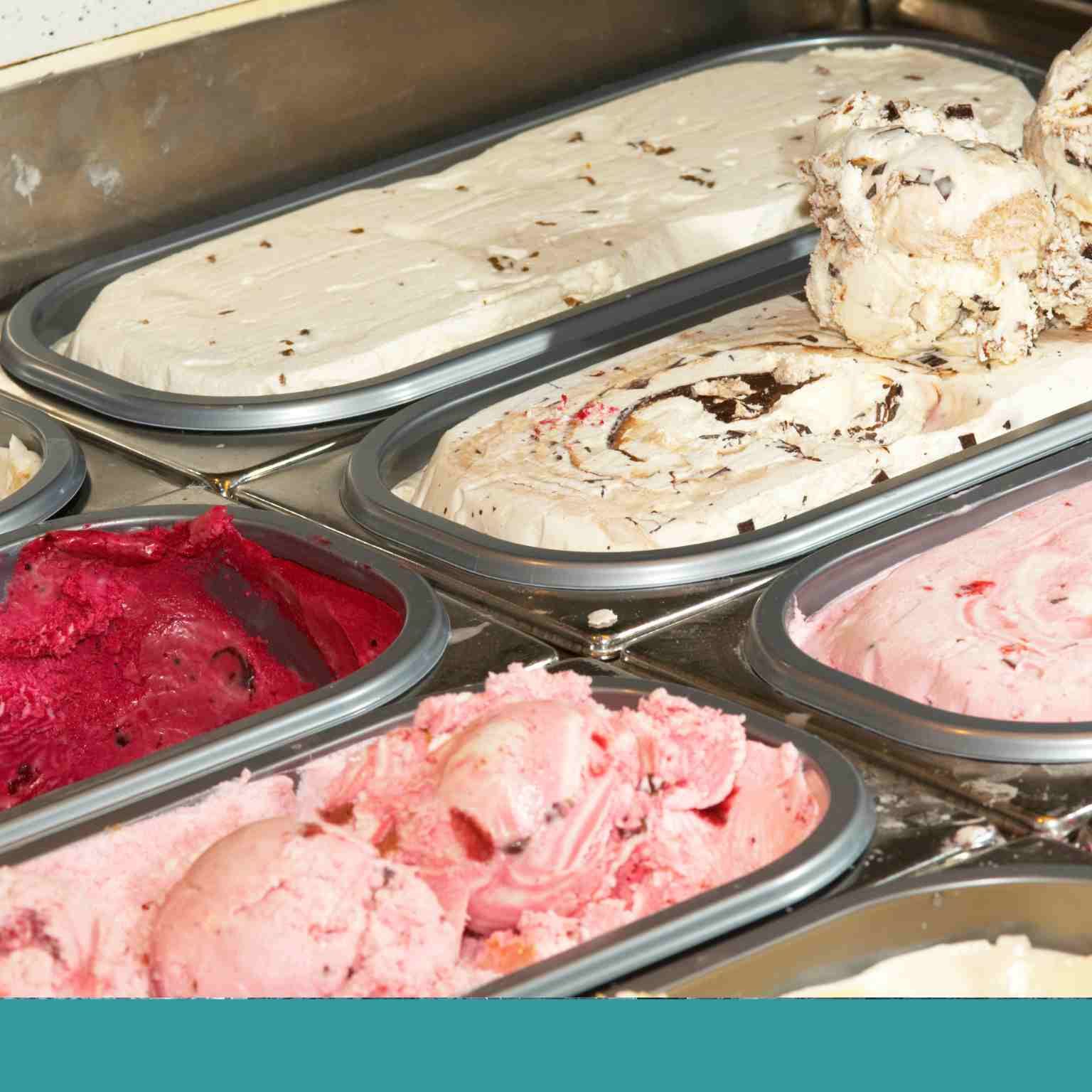 Scoop ice cream in tubs in a freezer
